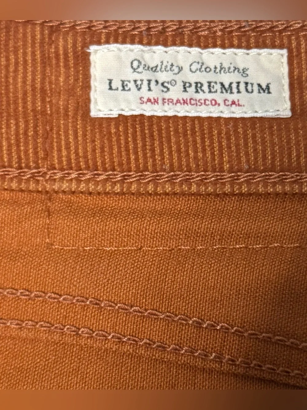 Levi’s Women’s Ribcage Flare Rust Orange Corduroy High Rise Pants Size 28